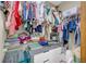 Walk-in closet with organized shelves, hanging rods, and storage drawers for optimal storage solutions at 10845 Shallowford Rd, Roswell, GA 30075