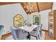 Formal dining room showcases a contemporary chandelier, stone table, and view to the outdoors at 10845 Shallowford Rd, Roswell, GA 30075