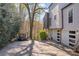 View of a long driveway leading to a two-car garage at 10845 Shallowford Rd, Roswell, GA 30075