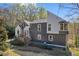 Charming two-story home nestled on a lush lot, showcasing its unique architecture at 10845 Shallowford Rd, Roswell, GA 30075
