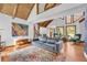 Open living area with high vaulted ceilings, hardwood floors and traditional furniture at 10845 Shallowford Rd, Roswell, GA 30075