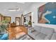 Bright living area with hardwood floors, skylights, modern furniture and access to the kitchen at 10845 Shallowford Rd, Roswell, GA 30075
