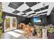 Cozy living room leading to a balcony with wood floors and paneled walls at 10845 Shallowford Rd, Roswell, GA 30075