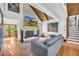 Spacious living room with high ceilings, stone fireplace, and large windows for ample natural light at 10845 Shallowford Rd, Roswell, GA 30075