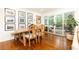 Bright dining area featuring wood table, adjacent to sliding door access to deck at 1329 W Nancy Creek Ne Dr, Brookhaven, GA 30319