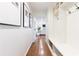 Bright hallway featuring hardwood floors, built-in storage, and seamless transition to the living spaces at 1329 W Nancy Creek Ne Dr, Brookhaven, GA 30319