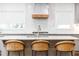 Stylish kitchen island with seating, countertop, and modern stainless steel faucet fixture at 1329 W Nancy Creek Ne Dr, Brookhaven, GA 30319