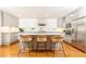 Modern kitchen with an island, stylish seating, stainless steel appliances, and custom cabinets at 1329 W Nancy Creek Ne Dr, Brookhaven, GA 30319