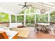 Relaxing screened porch with comfortable seating and views of the surrounding greenery at 1329 W Nancy Creek Ne Dr, Brookhaven, GA 30319