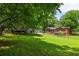 Spacious backyard featuring a lush green lawn and mature trees, ideal for outdoor activities and entertaining at 2041 Trailwood Rd, Decatur, GA 30032