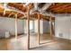 Unfinished basement featuring support beams, exterior door, and visible ductwork at 2041 Trailwood Rd, Decatur, GA 30032