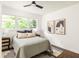 Bright bedroom features light-colored walls, neutral decor, and natural light from windows at 2041 Trailwood Rd, Decatur, GA 30032