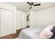 Bedroom with wood floor features ensuite bath and double door closet at 2041 Trailwood Rd, Decatur, GA 30032