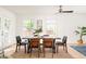 Bright dining room features French doors, modern ceiling fan, and natural light at 2041 Trailwood Rd, Decatur, GA 30032