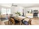 Bright dining room with kitchen and cozy seating area, modern ceiling fan, and natural light at 2041 Trailwood Rd, Decatur, GA 30032