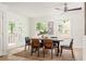Bright dining room features French doors, modern ceiling fan, and natural light at 2041 Trailwood Rd, Decatur, GA 30032