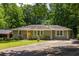 Inviting home with a lush lawn, mature trees, and a spacious driveway, offering curb appeal at 2041 Trailwood Rd, Decatur, GA 30032
