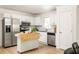 Spacious kitchen features stainless steel appliances, ample counter space, and modern white cabinetry at 2041 Trailwood Rd, Decatur, GA 30032
