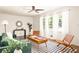 Sun-drenched living room with a modern aesthetic, featuring neutral walls and bright windows at 2041 Trailwood Rd, Decatur, GA 30032