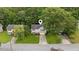 A lovely home nestled among mature trees with a well-manicured lawn, complemented by a private driveway at 5519 Princeton Oaks Ln, Sugar Hill, GA 30518