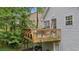 Large back deck offering serene outdoor living space and backyard views at 5519 Princeton Oaks Ln, Sugar Hill, GA 30518