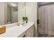 Bathroom with a vanity with a sink, and a shower with a curtain at 5519 Princeton Oaks Ln, Sugar Hill, GA 30518