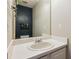 Bathroom featuring a large mirror, clean counter tops, and modern decor at 5519 Princeton Oaks Ln, Sugar Hill, GA 30518