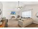 Bright living room with a fireplace, vaulted ceiling, plush seating, and contemporary decor at 5519 Princeton Oaks Ln, Sugar Hill, GA 30518