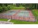 Community tennis courts with green court surface, surrounded by a chain link fence, and manicured lawns at 5519 Princeton Oaks Ln, Sugar Hill, GA 30518