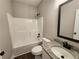Bathroom featuring a vanity with granite countertop and a shower-tub combo at 92 Jeffrey Ln, Dallas, GA 30157