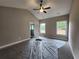 Spacious main bedroom with vaulted ceiling, ceiling fan, and two large windows at 92 Jeffrey Ln, Dallas, GA 30157