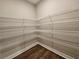 Spacious walk-in closet with shelving for ample storage at 92 Jeffrey Ln, Dallas, GA 30157