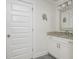 Bathroom with white vanity, granite countertop and a large mirror at 176 Olympic Pl, Decatur, GA 30030