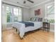 Bedroom featuring hardwood floors, natural light, and neutral paint at 176 Olympic Pl, Decatur, GA 30030