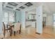 Open dining room featuring a decorative light fixture, stylish ceiling, and access to the kitchen at 176 Olympic Pl, Decatur, GA 30030