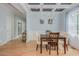 Elegant dining room with a coffered ceiling, hardwood floors, and a modern light fixture at 176 Olympic Pl, Decatur, GA 30030