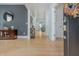 Inviting foyer featuring hardwood floors, stylish decor, and a view into the home's interior at 176 Olympic Pl, Decatur, GA 30030