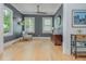 Bright living room features beautiful hardwood floors, neutral paint, and large windows at 176 Olympic Pl, Decatur, GA 30030