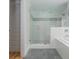Spacious main bathroom featuring a glass shower, soaking tub, and modern tile flooring at 176 Olympic Pl, Decatur, GA 30030