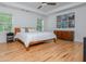 Serene main bedroom with a comfortable bed, modern furniture, and natural light at 176 Olympic Pl, Decatur, GA 30030