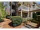 Multi-level home showcasing a deck and well-maintained landscaping at 2135 N Forest Trl, Dunwoody, GA 30338