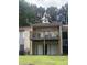Balcony with wood railings and outdoor furniture, perfect for enjoying the surrounding view at 3575 Oakvale Rd # 919, Atlanta, GA 30034