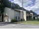 Two-story condo featuring balconies, landscaped lawns, and a mix of siding and stucco exterior at 3575 Oakvale Rd # 919, Atlanta, GA 30034