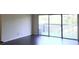 Spacious living room with modern flooring and sliding glass doors to a balcony with wooded views at 3575 Oakvale Rd # 919, Atlanta, GA 30034