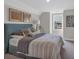 Cozy bedroom featuring carpet, a queen bed, framed artwork, and a window at 71 Colonial Terrace, Villa Rica, GA 30180