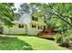 View of the backyard featuring a wooden deck that enhances outdoor living and entertaining at 10035 Anaheim Dr, Alpharetta, GA 30022