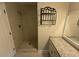 Modern bathroom with stand-up shower, granite countertops, and large mirror at 10035 Anaheim Dr, Alpharetta, GA 30022