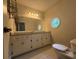 Corner bathroom with a sink and toilet at 10035 Anaheim Dr, Alpharetta, GA 30022