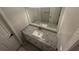 Bathroom vanity featuring granite countertop, white cabinetry, a modern faucet, and ample lighting at 10035 Anaheim Dr, Alpharetta, GA 30022