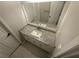 Bathroom vanity featuring granite countertop, white cabinetry, a modern faucet, and ample lighting at 10035 Anaheim Dr, Alpharetta, GA 30022